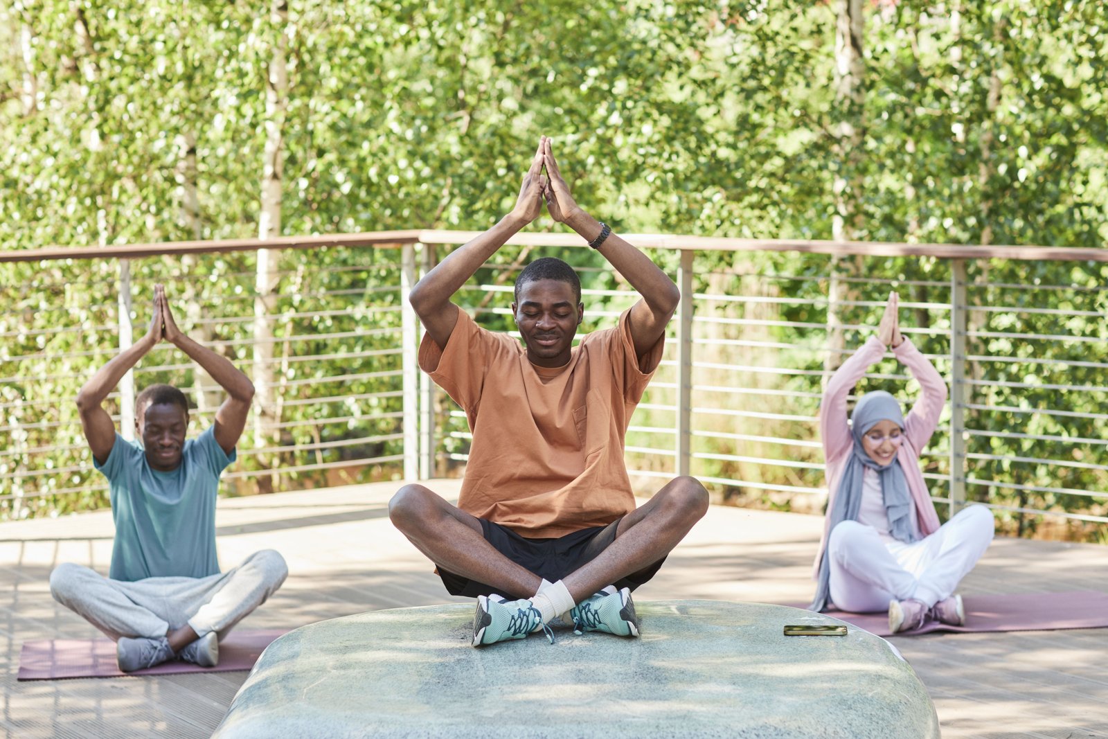 People practising mindful movement together outdoors