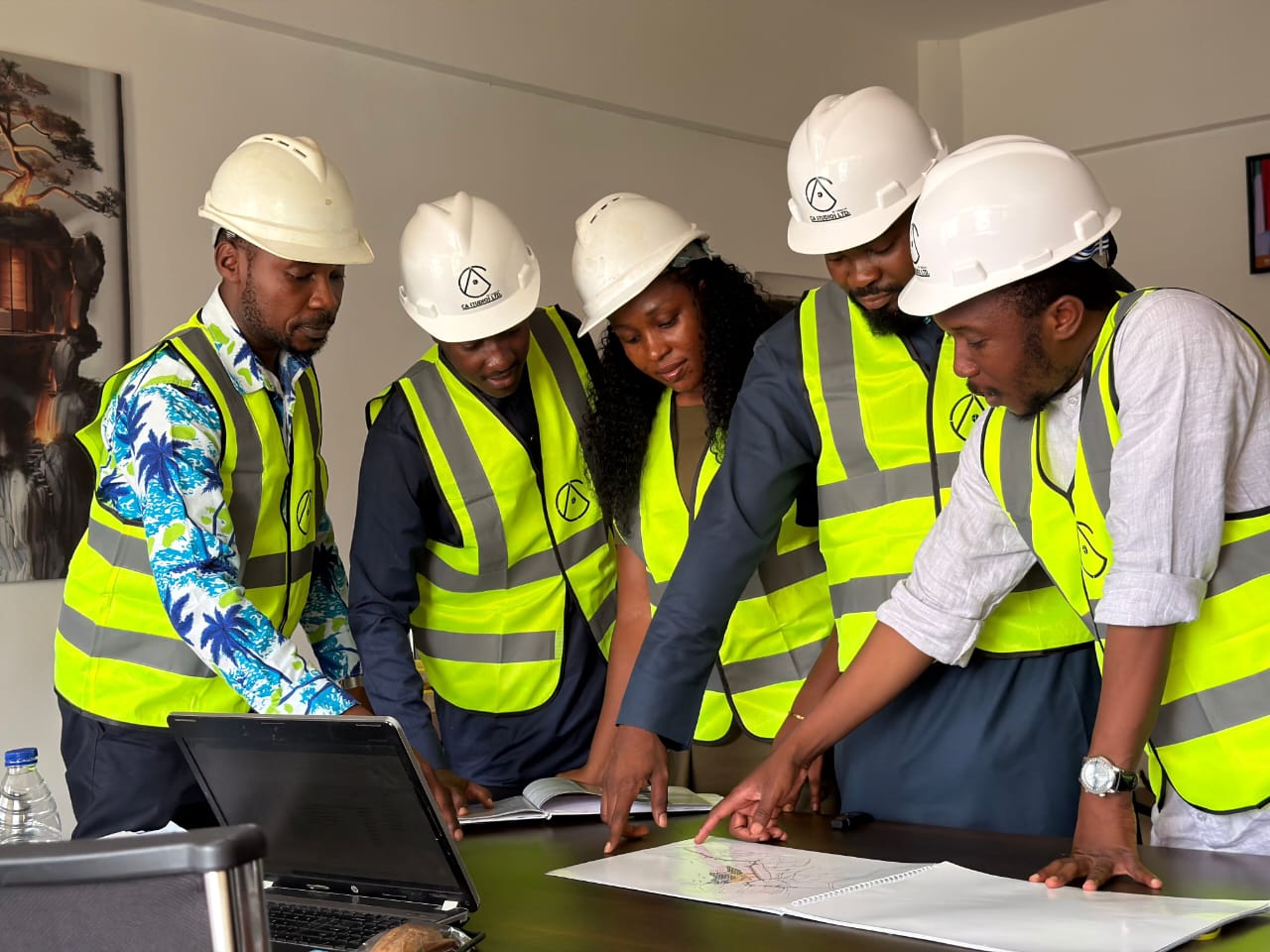 Engineering team reviewing project plans on site